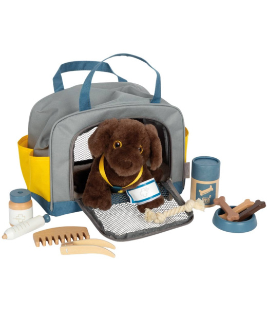 Chien avec sac et kit de soins